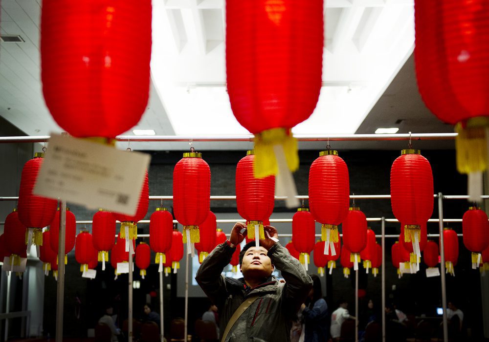 Students try to guess lantern riddles during BUCSSA's Chinese New Year celebration at GSU on Friday, February 14, 2014.  Photo by Jacke Ricciardi for Boston University Photography